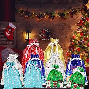 May include: A collection of assorted Christmas gift bags featuring various festive patterns including snowflakes, reindeer, and snowmen. The bags are made of shiny metallic material in red, gold, blue, green, and white, each secured with a white ribbon tie.