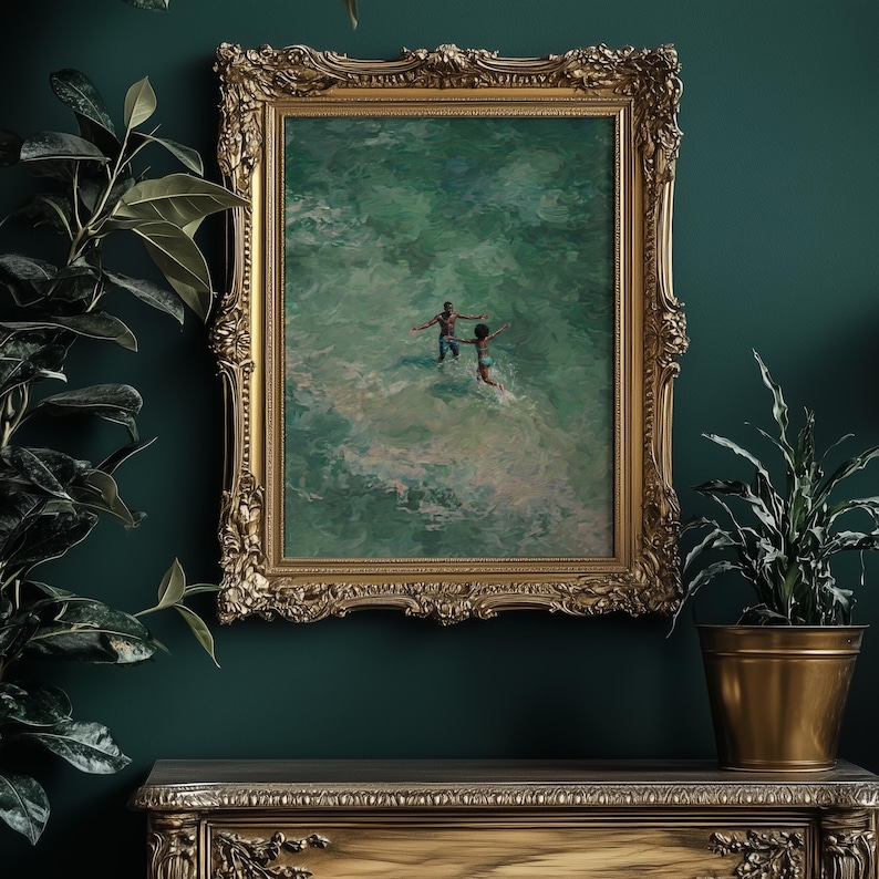 Opulent interior mockup featuring Afrocentric wall art in an heavily ornate gold frame against a deep emerald green wall. The ocean oil painting depicts a Black couple amidst turquoise waves, serving as a luxurious Black love art statement piece surrounded by plants.