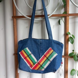 Small denim bag with handwoven elements, zipper, carrying strap, inner lining, several inside pockets, size: 37 x 27 cm