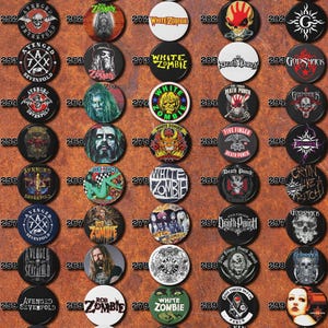 May include: A collection of 30 round button pins featuring various rock bands, including Avenged Sevenfold, Rob Zombie, White Zombie, Five Finger Death Punch, and Godsmack. The pins are arranged in a grid pattern on a brown background.