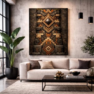 May include: A framed artwork featuring a detailed geometric design in brown, grey, and orange hues. The artwork is mounted on a textured, dark background. It hangs above a cream sofa in a modern living room setting, with a large plant.