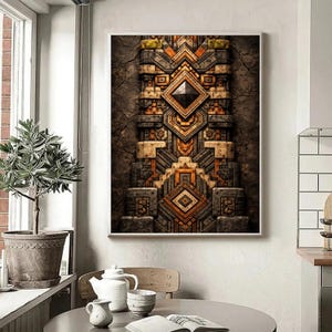 May include: Framed artwork with a detailed geometric design in brown, orange, and grey. The textured artwork features a central diamond shape and layered patterns, reminiscent of ancient architecture.