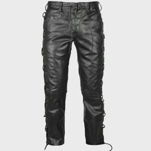 May include: Black leather pants with lace-up detailing at the front and sides. The pants have a classic five-pocket design and a straight leg cut. The leather appears to be slightly textured.