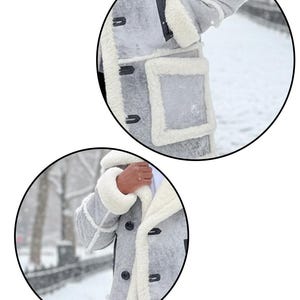 May include: A gray coat with white faux fur trim and lining. The coat features a button-up front, a hood, and pockets. The sleeves have white fur cuffs. The coat is shown in a snowy outdoor setting.
