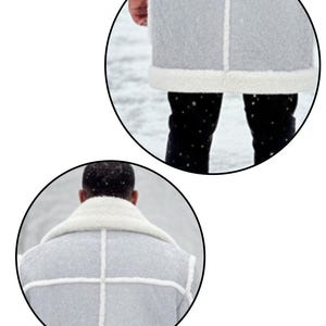 May include: A light gray coat with white trim and accents. The coat features a white, fluffy collar and lining. The coat is worn over black pants. The image is taken outdoors in a snowy environment.