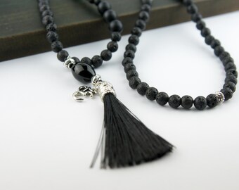 108 Lava Stone Mala Necklace – All-Black Lava Beads, Om Charm & Black Silk Tassel | Grounding Meditation Beads | Handmade Yoga Jewelry