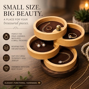 May include: A multi-tiered wooden jewelry organizer with rotating circular trays featuring dark brown felt lining. The light wood structure holds various pieces of jewelry including rings, earrings, and necklaces. Text on the image reads: SMALL SIZE. BIG BEAUTY. A PLACE FOR YOUR treasured pieces.