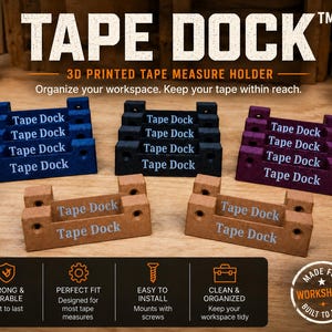May include: A collection of 3D printed Tape Dock tape measure holders in blue, black, purple, and tan. Each rectangular holder features the text Tape Dock, mounting holes on the sides, and a central slot for a tape measure. The holders are arranged in rows.