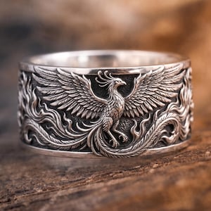 Anillo Fénix artesanal, banda ancha de plata de ley oxidada, joyería de fantasía y renacimiento.