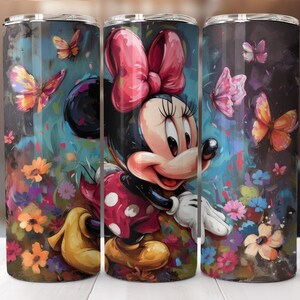 May include: A tumbler featuring a colorful illustration of Minnie Mouse surrounded by butterflies and flowers. The design includes a large red bow, a polka-dot dress, and a vibrant floral background. The tumbler is cylindrical and has a silver lid.