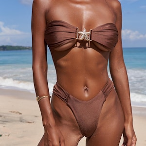 Brown cheeky bikini, ruched bandeau top and brazilian bottom. Swimsuit with starfish accessory