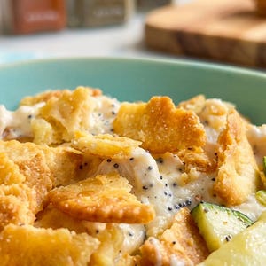 May include: A set of three ceramic mugs with a speckled, matte finish. The mugs are in shades of cream, light gray, and dark gray. Each mug has a simple, minimalist design, perfect for coffee or tea.