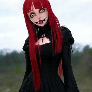 May include: A gothic-style doll with long, vibrant red hair and a black dress. The doll has a unique face design with large, stylized eyes and a mouth with sharp teeth. The dress features a fitted bodice and a flowing skirt, creating a dramatic silhouette.