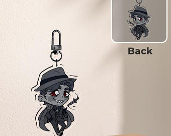 May include: A clear acrylic keychain featuring a cartoon illustration of a character in a fedora and suit, holding a knife. The keychain has a silver clasp and a matching illustration on the back. The word "Front" is printed on the front.