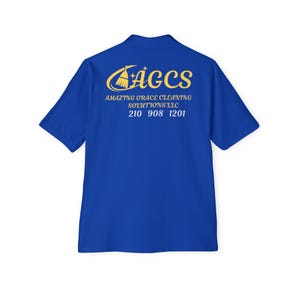 May include: Royal blue short-sleeved shirt with a yellow logo and text on the back. The logo features a stylized broom and the text reads "AGCS Amazing Grace Cleaning Solutions LLC 210 908 1201".
