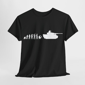 May include: Black t-shirt featuring a white graphic depicting the evolution of man, culminating in a tank. The design shows a progression from ape-like figures to a person operating a tank.