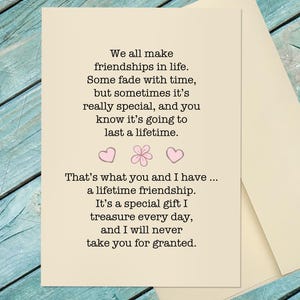 May include: A cream-colored greeting card featuring black printed text that reads: We all make friendships in life. Some fade with time, but sometimes it’s really special, and you know it’s going to last a lifetime. Two pink hearts and a flower icon.