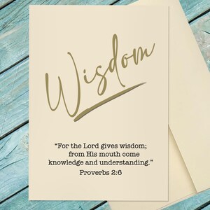 May include: A cream-colored greeting card with the word "Wisdom" in gold script. The card includes a quote from Proverbs 2:6: "For the Lord gives wisdom; from His mouth come knowledge and understanding."