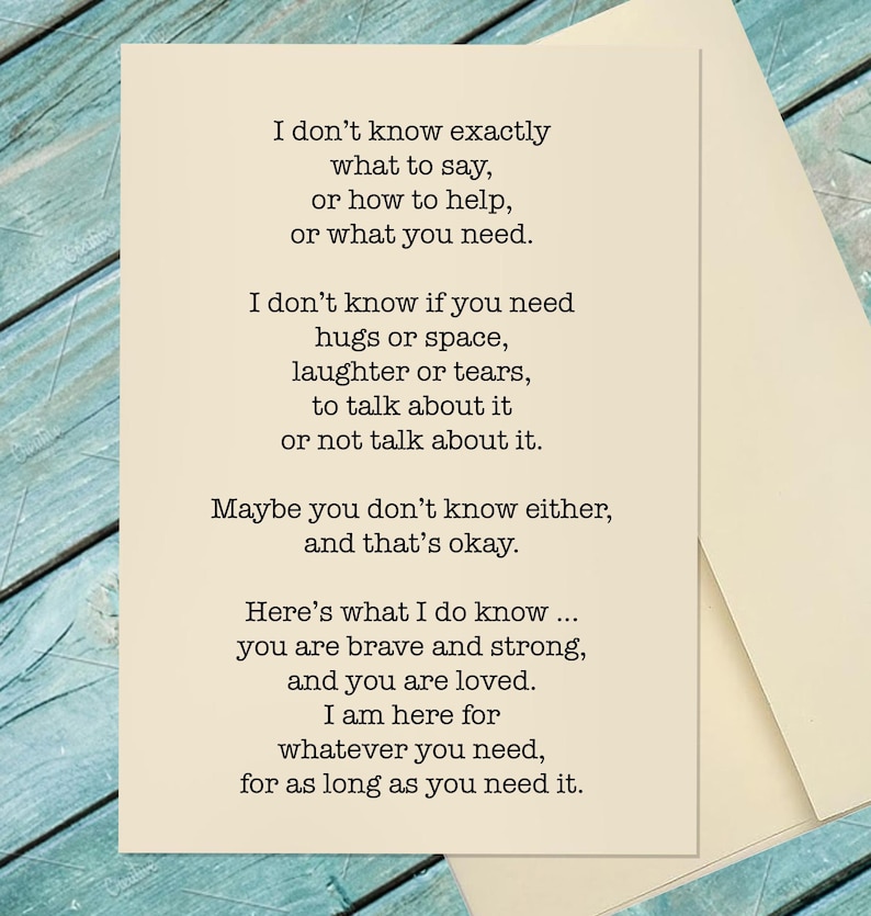 May include: A cream-colored greeting card with a heartfelt message printed in black. The text offers support and reassurance, with phrases like "you are brave and strong, and you are loved." The card is accompanied by a matching envelope.