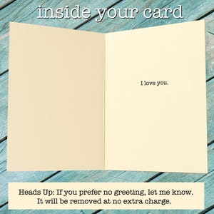 May include: An open greeting card with a cream-colored interior. The text 'inside your card' appears at the top. The right panel features the printed text 'I love you.' A bottom note states: 'Heads Up: If you prefer no greeting, let me know. It will be removed at no extra charge.'