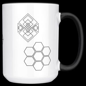 May include: White ceramic mug with a black handle and rim. The mug features two geometric designs in black: a diamond-shaped pattern and a cluster of hexagons. The mug is designed for hot beverages.