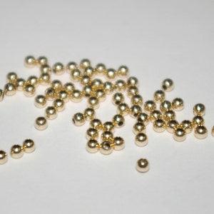 100 pieces 14kt GOLD FILLED 2.5mm Round Seamless Spacer or Crimp BEADS Lot. Alternative to solid gold. Free Shipping Worldwide.