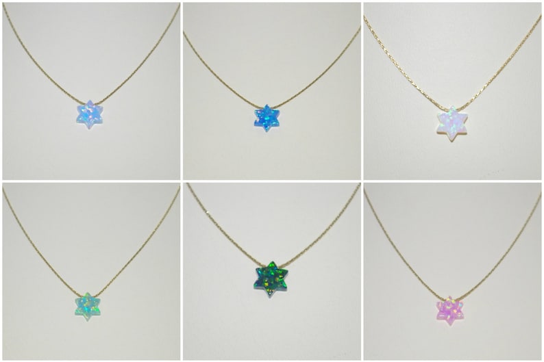 May include: Six gold necklaces with a star of David pendant made of iridescent opal. The opals are in various colors, including blue, green, pink, and white.