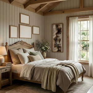 May include: A bedroom with a wooden bed frame, nightstand, and ceiling beams. The bed is made with neutral-toned bedding and pillows, with a beige knitted throw blanket. The room has framed artwork and a window with sheer curtains.