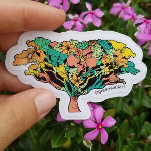 May include: A colourful sticker featuring a tree with a floral design. The tree is made up of various flowers in shades of pink, yellow, orange, and green. The sticker has a white background and the text "@greenwellart" is printed in the bottom right corner.