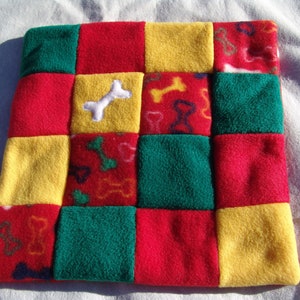XS Fleece dog blanket - bones on red