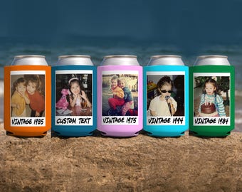 May include: Five colorful can coolers with vintage photos and text. The coolers are orange, blue, pink, teal, and green. Each cooler has a different photo and the text "VINTAGE" followed by a year, or "CUSTOM TEXT".