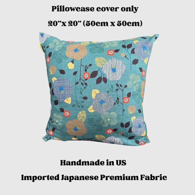 May include: A square pillowcase cover measuring 20 inches by 20 inches. The fabric is teal and features a repeating pattern of stylized flowers in shades of tan, yellow, blue, and orange, with thin dark brown stems and leaves throughout the design.