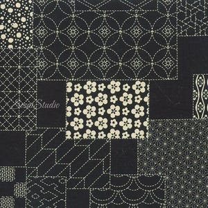 May include: A black fabric featuring a patchwork design of various white geometric and floral patterns. The print includes circles, dots, lines, and flower motifs arranged in rectangular sections. The text "Sizai Studio" is visible on the left.