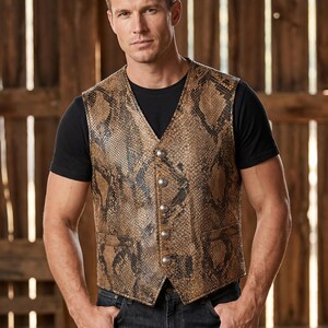 May include: A sleeveless vest featuring a brown and black snakeskin pattern, a V-neckline, and five round silver-toned metal buttons down the front. The garment includes two horizontal welt pockets at the waist and a pointed hemline at the front.
