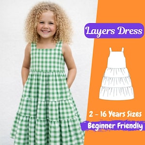 May include: A young girl wearing a green and white checkered dress with a square neckline and tiered skirt. The image includes the text "Layers Dress", "2 - 16 Years Sizes", and "Beginner Friendly".