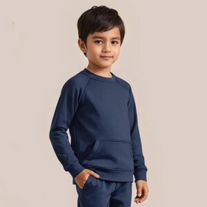 May include: A navy blue long-sleeved sweatshirt with a front pocket. The sweatshirt has a crew neck and raglan sleeves.