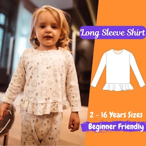 Puede incluir: Una camisa blanca de manga larga con un dobladillo con volantes. La camisa es un patrón de costura para tallas de 2 a 16 años y es fácil para principiantes. El texto "Long Sleeve Shirt" está en texto morado sobre un fondo morado claro. El texto "2-16 Years Sizes" está en texto blanco sobre un fondo morado. El texto "Beginner Friendly" está en texto blanco sobre un fondo morado.