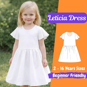 May include: A young girl in a white dress with flutter sleeves and a round neckline. The dress has a gathered skirt. The image includes a diagram of the dress and text: "Leticia Dress", "2 - 16 Years Sizes", and "Beginner Friendly".