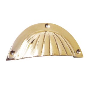 May include: A brass-colored, half-moon shaped cabinet pull with a shell-like design. The pull has three screw holes for mounting and a ridged interior. The hardware is made of metal and is designed for use on drawers or cabinets.