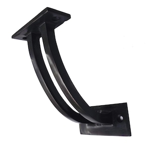 May include: A dark bronze metal shelf bracket. It features a rectangular top and bottom plate, linked by two curved supports. The design is simple and modern, suitable for various interior styles. The bracket is likely made of steel.