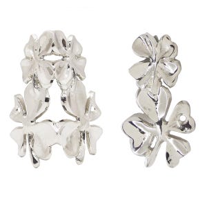 May include: Silver earrings with a floral design. The earrings feature a cluster of four-leaf clover shapes, with a polished, reflective surface. The design is symmetrical and detailed, with visible veins on the leaves.