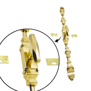 May include: A polished brass door bolt with a decorative handle and matching strike plates. The bolt is shown in two views, one zoomed in, against a white background. The hardware is designed for security and aesthetic appeal.