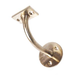 May include: A brass handrail bracket with a curved arm and two mounting plates. The bracket has a brushed finish.