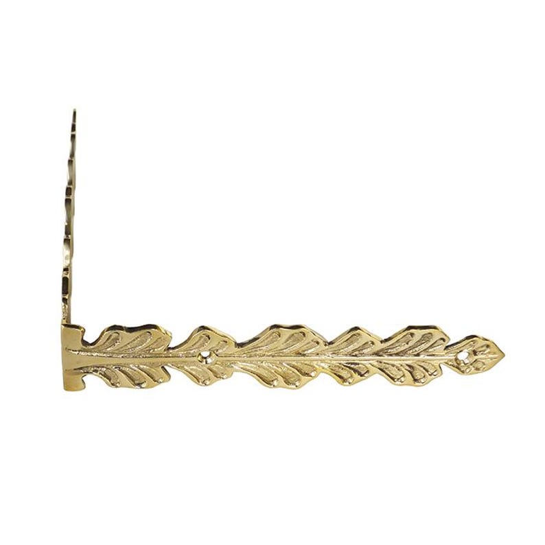 May include: Gold metal corner bracket with a decorative leaf design. The bracket has a right angle and is designed to be used as a decorative corner piece.