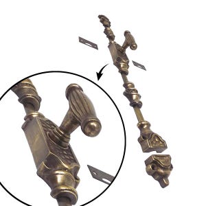 May include: An antique brass window sash lock with decorative detailing. The lock features a handle, a long rod, and a decorative base. Includes small metal plates for installation. The close-up shows intricate carvings.