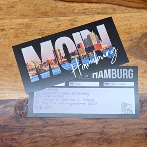 Gedruckter Reisegutschein Hamburg mit Vorder- und Rückseite