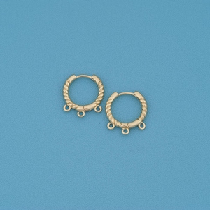 May include: A pair of gold-toned hoop earrings featuring a twisted rope texture along the circular band. Each hoop includes three small, evenly spaced jump rings attached to the bottom edge, designed for hanging additional decorative charms or beads.