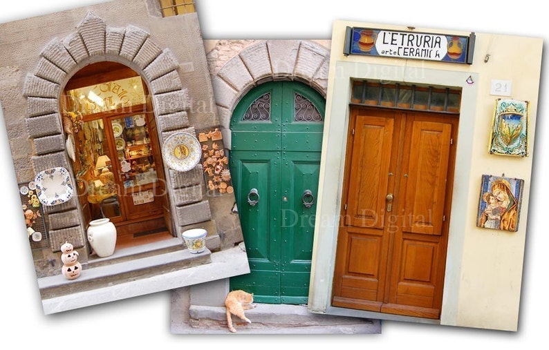 May include: Three doorways in a row, each with a unique style. The first doorway is arched and has a shop window filled with ceramic plates and other pottery. The second doorway is a double green door with a decorative metal design. The third doorway is a double wooden door with a sign above that reads "L'Etruria art e ceramica".