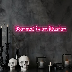 May include: A neon sign with the text "Normal is an illusion" in pink. The sign is mounted on a dark gray wall, with decorative skulls, candles, and candle holders. The overall theme is gothic and spooky.