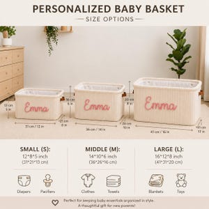 May include: Three off-white woven storage baskets with the name Emma embroidered in pink. The baskets are shown in small, medium, and large sizes with dimensions ranging from 12 by 8 by 5 inches to 16 by 12 by 8 inches, featuring brown side handles.